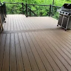 Close view of composite deck boards with black railings by Abrams Restoration in Batavia, Ohio